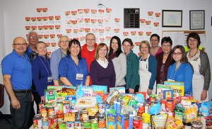 Volunteers, organizers and patrols pose with donations for Stephenville Emergency Food Services. 