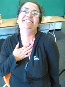 Rachel Young proudly displays her newly acquired WorldHost lapel pin.